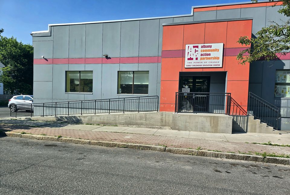 After: new entry stairs, accessible ramp and steel guardrails, June 2026