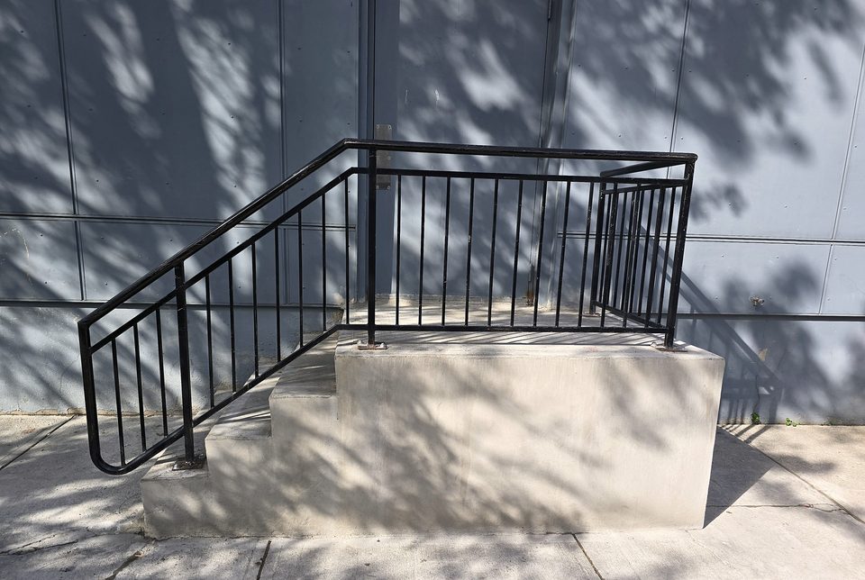 Detail: fabricated steel guardrail at the landing