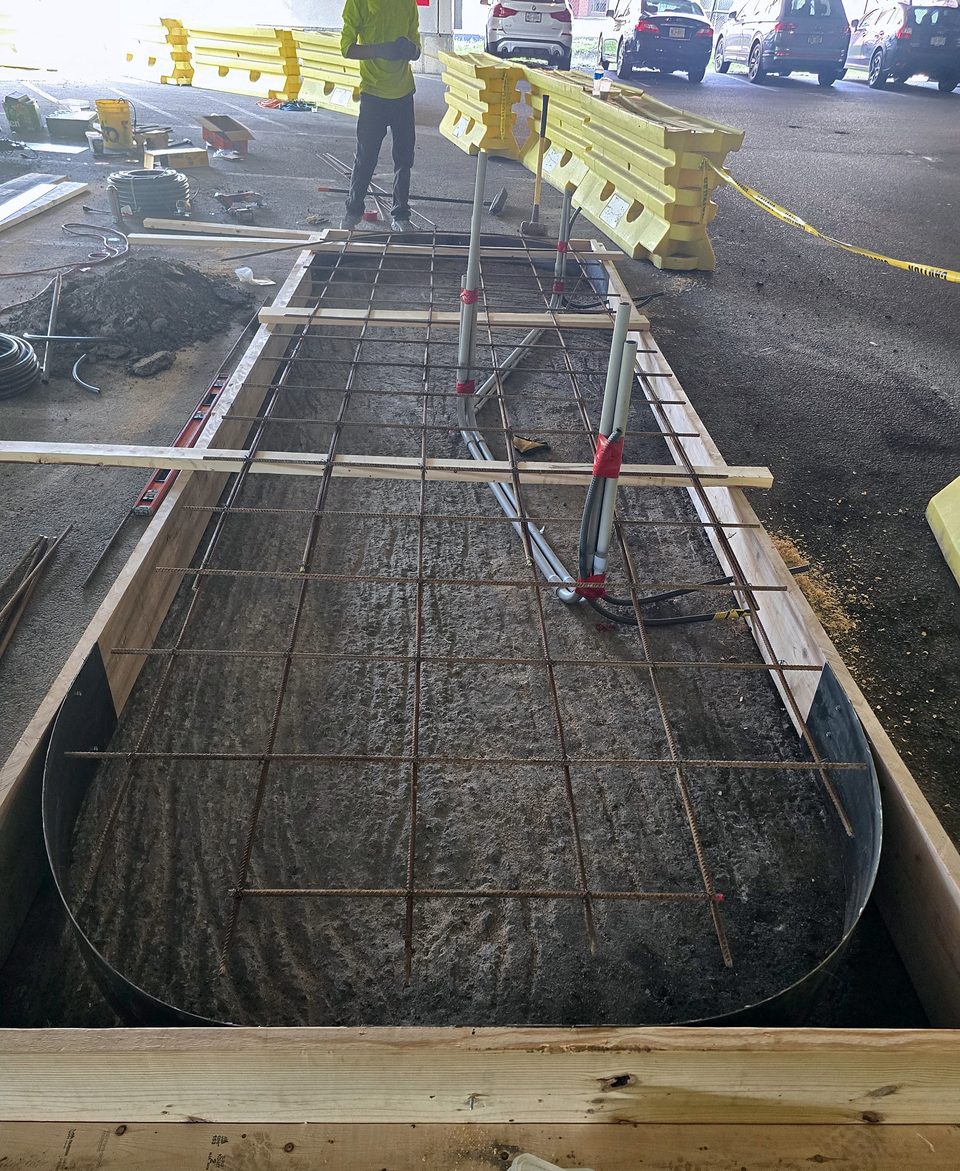 During: forms, reinforcing mat and conduit stub-ups, August 2026