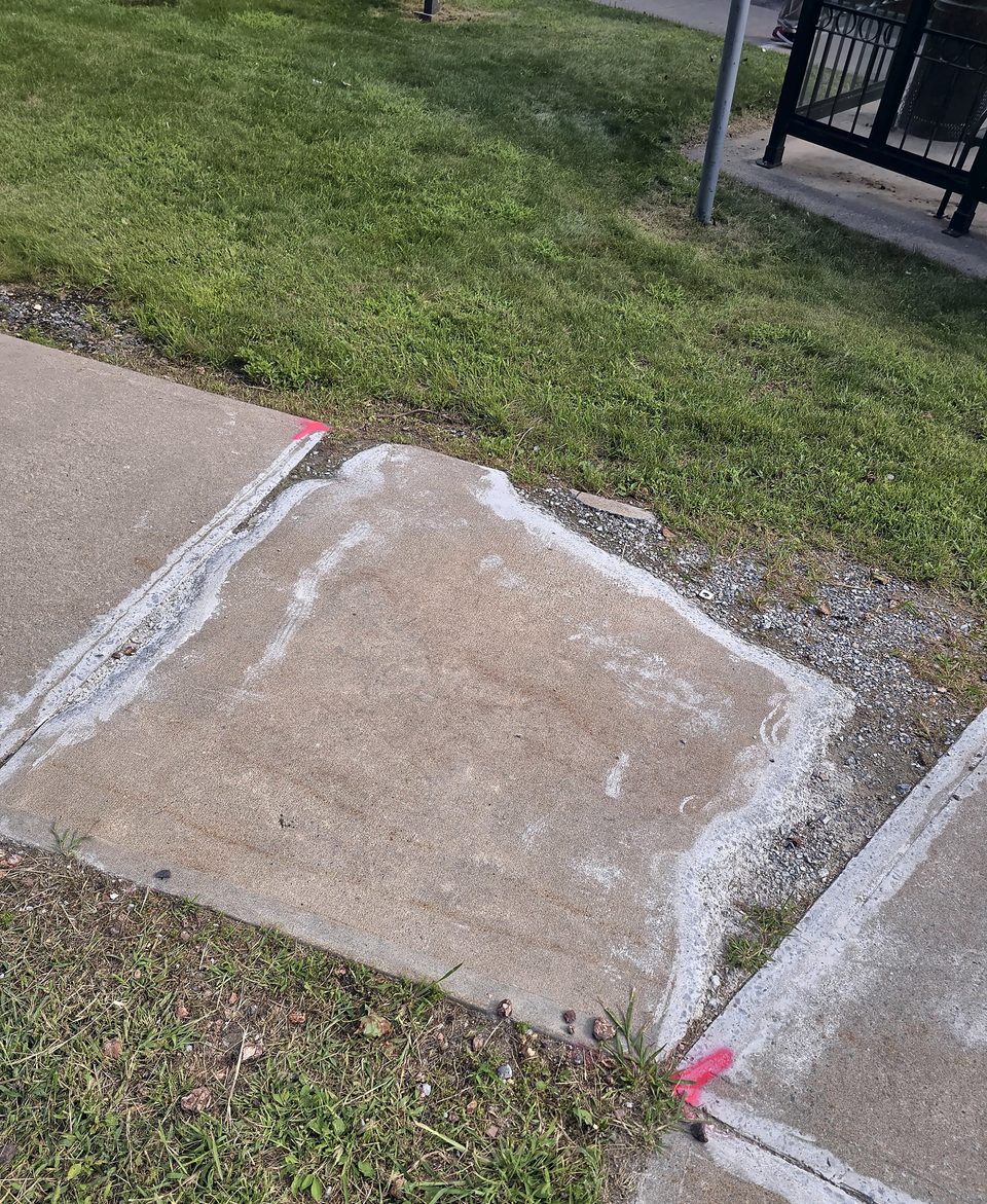 After: a replaced sidewalk panel, August 2026