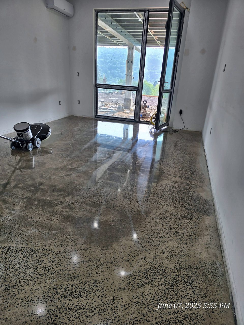 Polished concrete floor with grinder