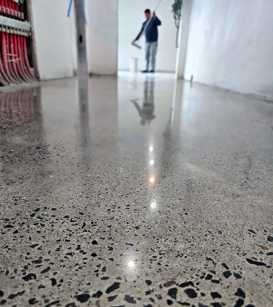 Polished corridor — the reflection is the finish, 2025