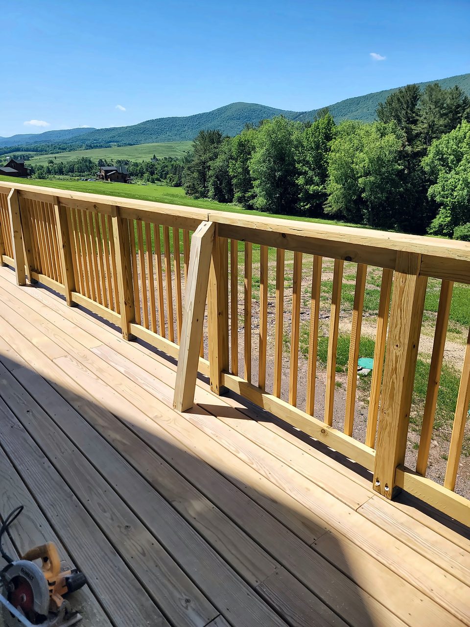 Cedar deck and railing with a Catskills view, 2022