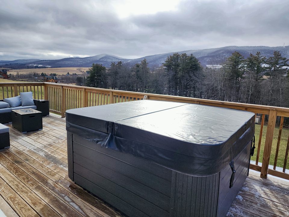 Deck with hot tub and a Catskills view, 2024