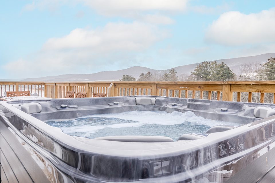 Deck hot tub facing the mountains