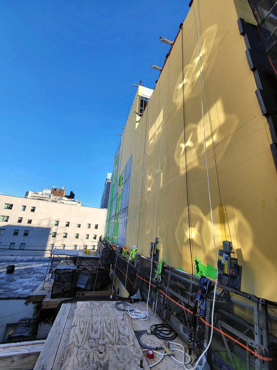 During: basecoat on the tall elevation
