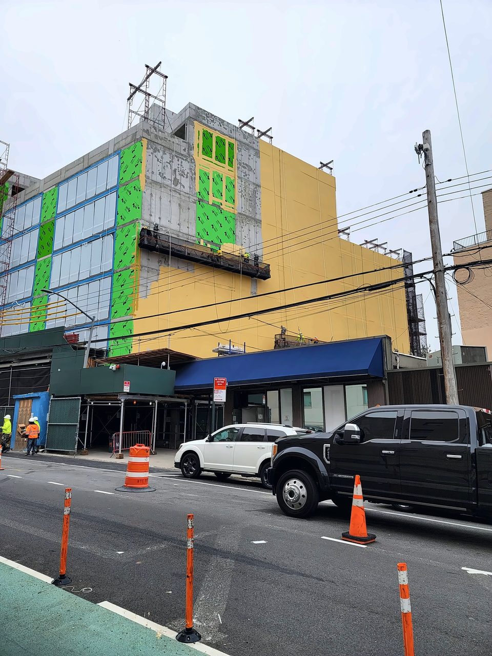 Before: sheathing and air barrier stage from the street