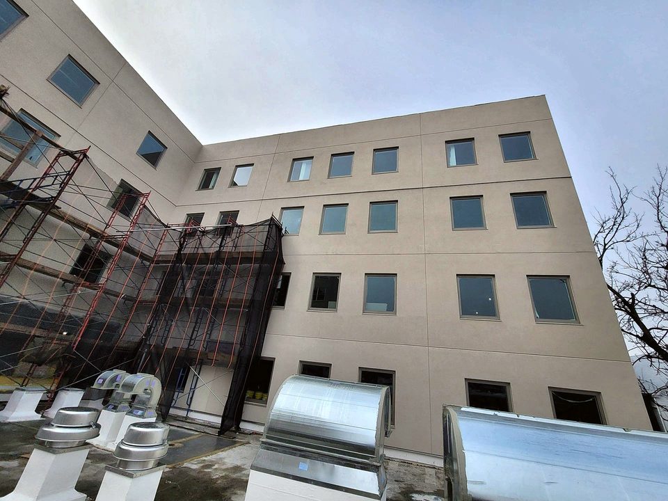 After: the completed building with scaffold coming down