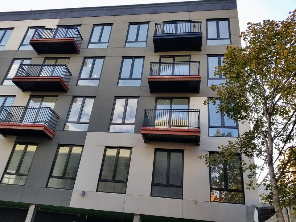 Multifamily EIFS facade with balconies, 2017
