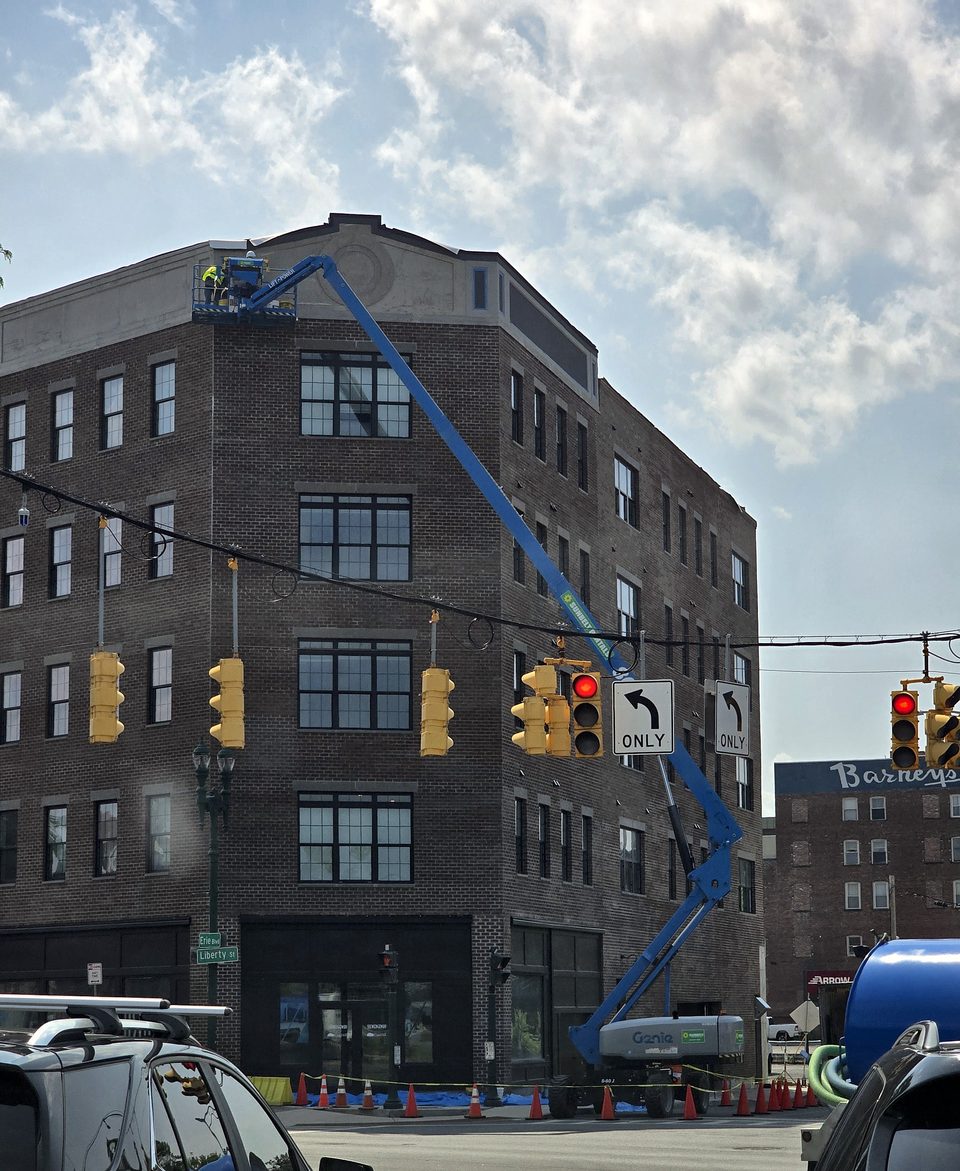 During: crew setting panels from the lift, July 2026