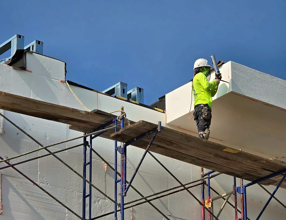 EIFS mechanic on scaffold, 2025