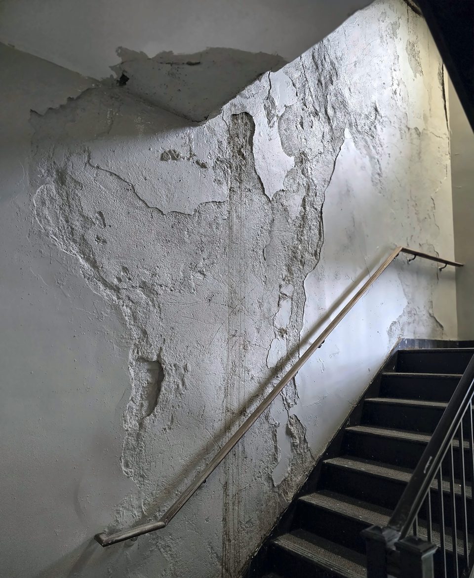 Before: water-damaged plaster in the Stair 2 stairwell