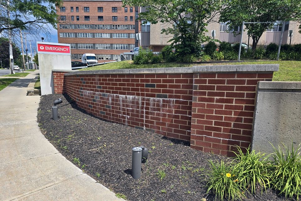 Before: efflorescence on the same wall, July 2026