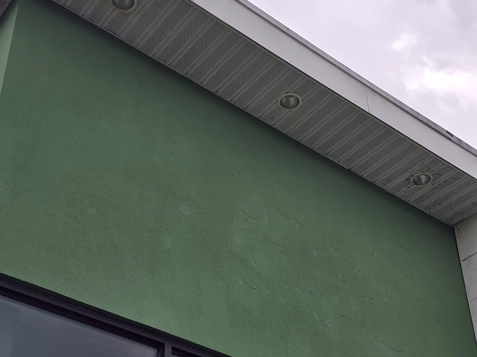 Repaired and color-matched EIFS finish coat on the Shake Shack in Clifton Park, September 2026