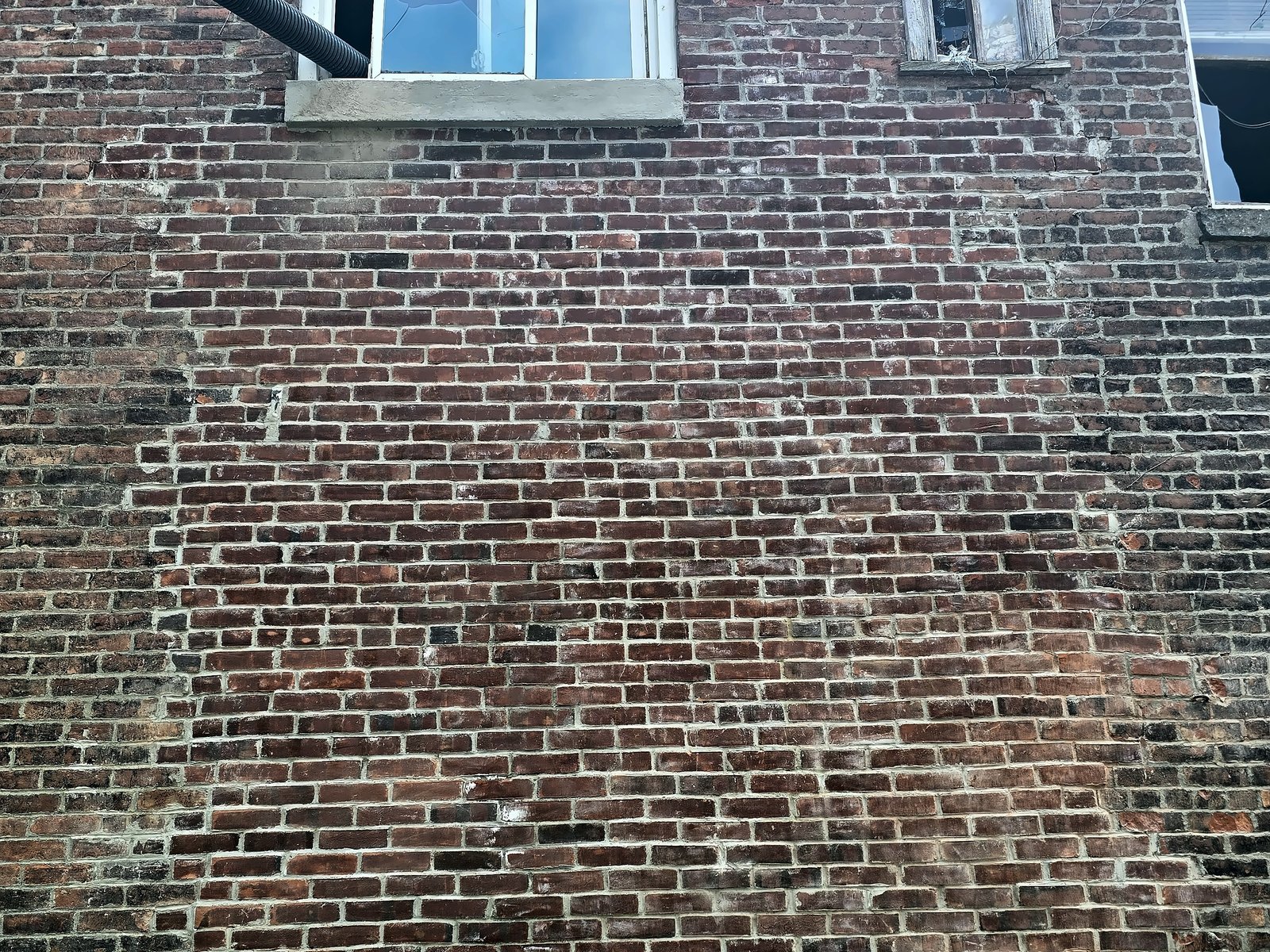 Rebuilt north elevation brick wall at 332 Ninth Street, Troy, after completion