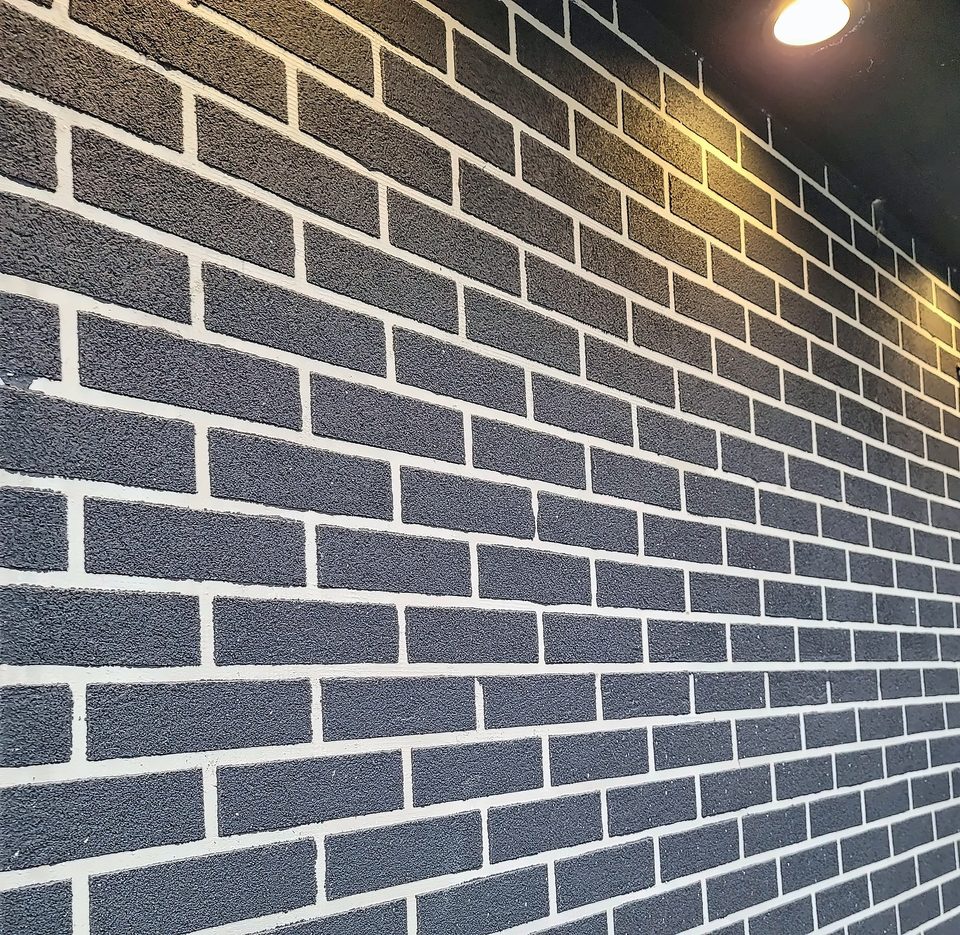 Dark brick with raked white joints, 2020