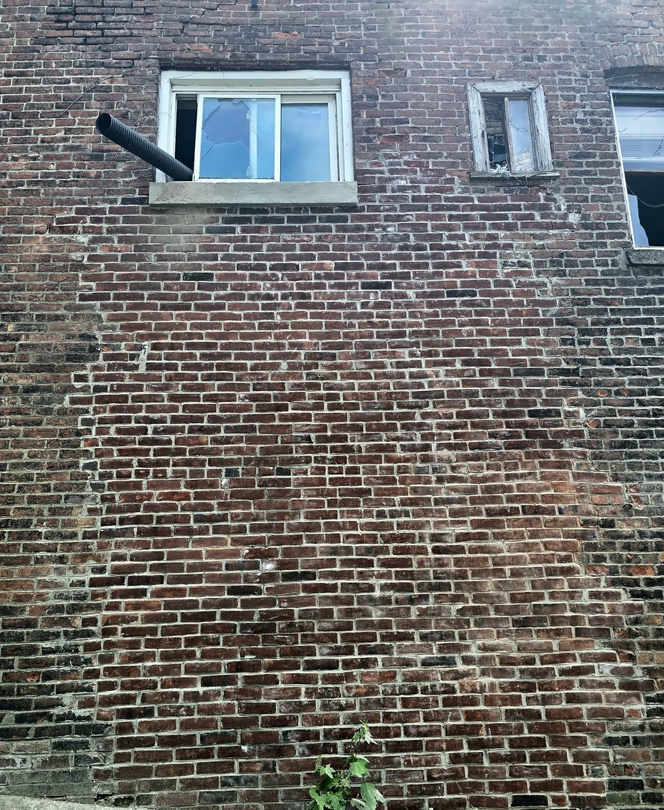 After: the rebuilt and repointed north elevation, August 2026