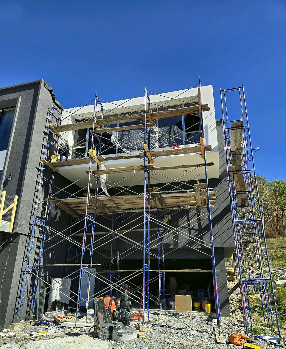 During: basecoat and finish from scaffold towers, October 2025
