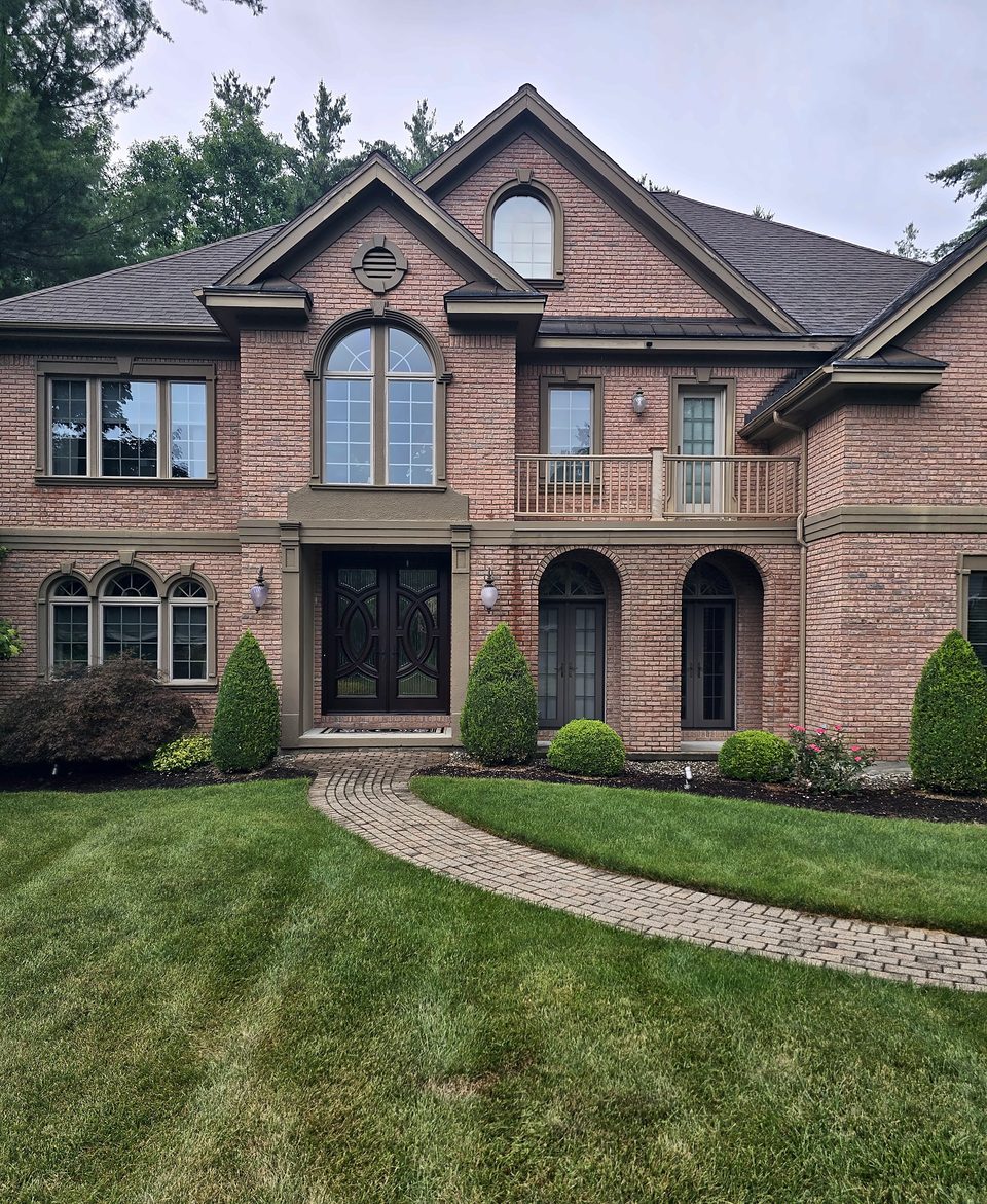 After: front entry and balcony, late July 2026