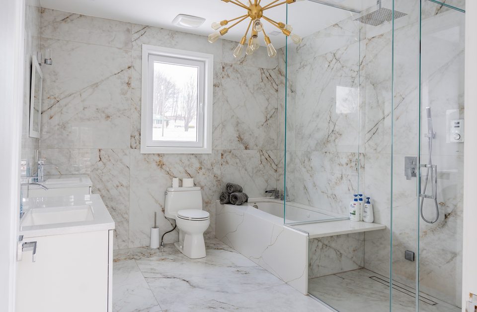 Marble-tile bathroom with soaking tub